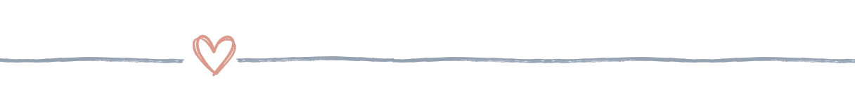 A horizontal blue-gray divider line with a soft pink heart in the center, used to visually break up content in reading and memory-focused resources.